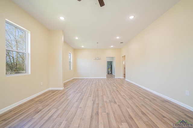 1104 N Bolivar St, Marshall, TX 75670 - unfurnished living room featuring a ceiling fan, baseboards, light wood finished floors, and recessed lighting