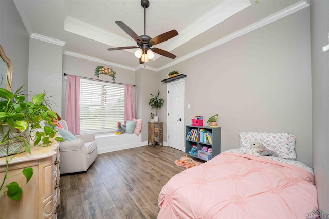 20064 Fm 1716 E, Tatum, TX 75691 - bedroom with baseboards, a raised ceiling, ornamental molding, and wood finished floors