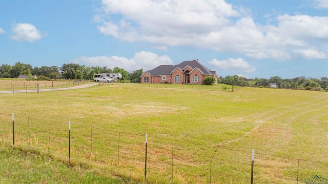 20064 Fm 1716 E, Tatum, TX 75691 - view of yard featuring a rural view, driveway, and fence