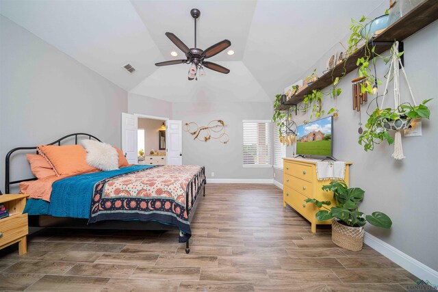 20064 Fm 1716 E, Tatum, TX 75691 - bedroom featuring baseboards, vaulted ceiling, visible vents, and wood finished floors