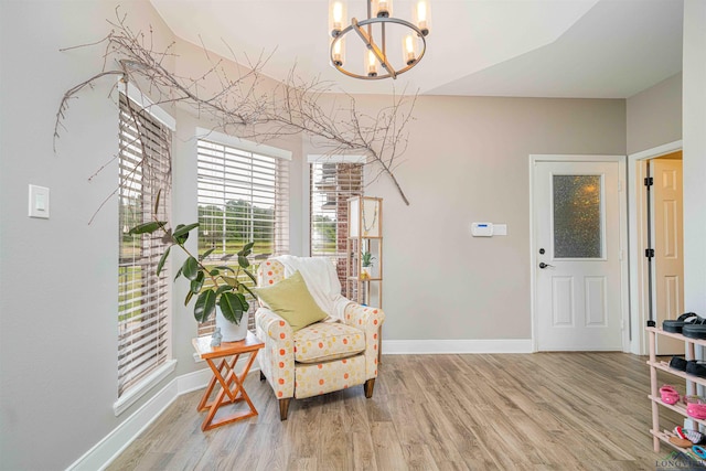 20064 Fm 1716 E, Tatum, TX 75691 - sitting room featuring an inviting chandelier, wood finished floors, and baseboards