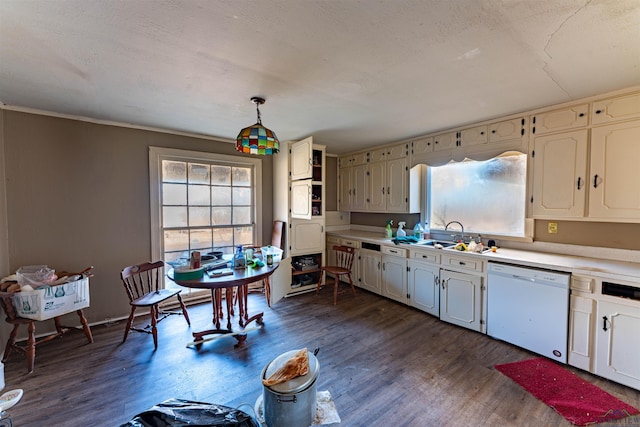 kitchen featuring a sink, dark wood-style flooring, light countertops, and white dishwasher