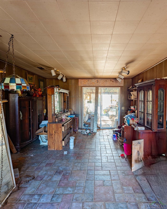interior space featuring wood walls