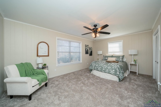 bedroom with crown molding, ceiling fan, and light carpet