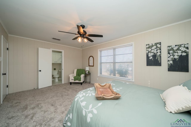 carpeted bedroom featuring connected bathroom, crown molding, and ceiling fan