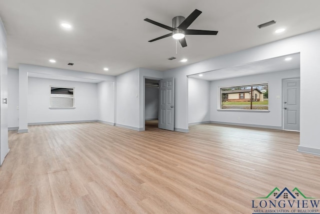 unfurnished living room featuring light hardwood / wood-style floors and ceiling fan