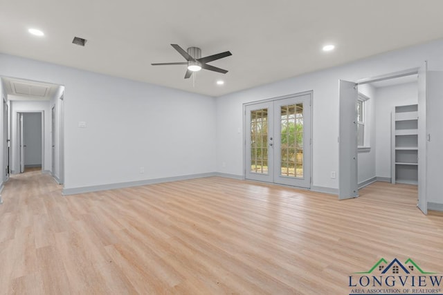 spare room featuring ceiling fan, light hardwood / wood-style floors, and french doors