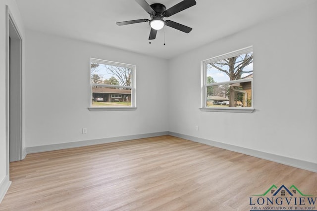 unfurnished room with ceiling fan and light wood-type flooring