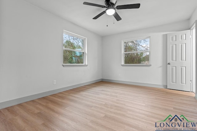 spare room with light hardwood / wood-style floors and ceiling fan