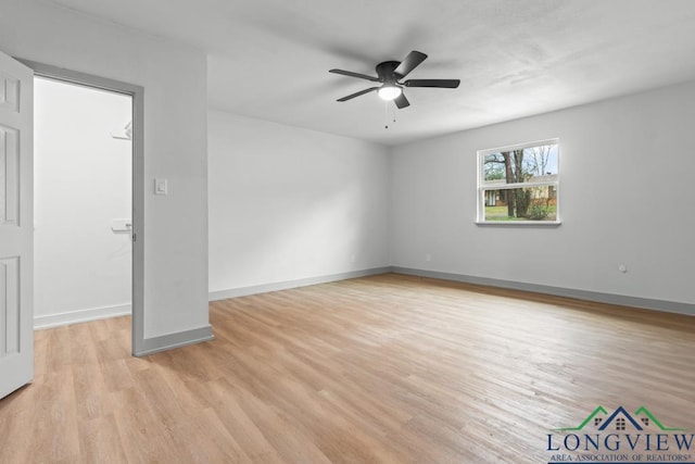 empty room with light hardwood / wood-style floors and ceiling fan