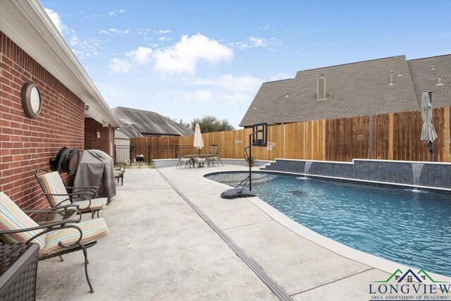 1900 Frostwood Dr, Tyler, TX 75703 - view of swimming pool featuring outdoor dining area, a fenced in pool, a fenced backyard, and a patio area