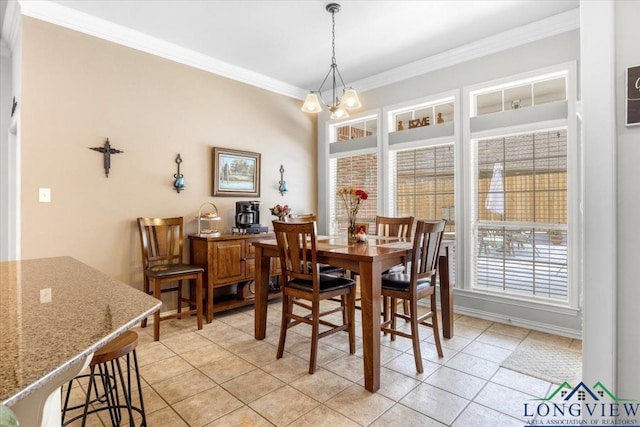 1900 Frostwood Dr, Tyler, TX 75703 - dining area featuring a chandelier, light tile patterned floors, and ornamental molding