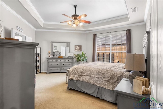 1900 Frostwood Dr, Tyler, TX 75703 - bedroom with visible vents, a raised ceiling, crown molding, and light colored carpet