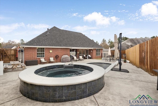 1900 Frostwood Dr, Tyler, TX 75703 - view of pool with an in ground hot tub, outdoor dining space, a fenced backyard, and a patio area