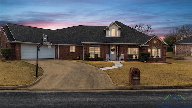 1900 Frostwood Dr, Tyler, TX 75703 - view of front of property with brick siding, a shingled roof, a lawn, concrete driveway, and an attached garage