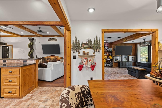 dining room featuring beamed ceiling