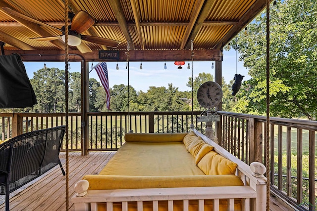 deck featuring outdoor lounge area and ceiling fan