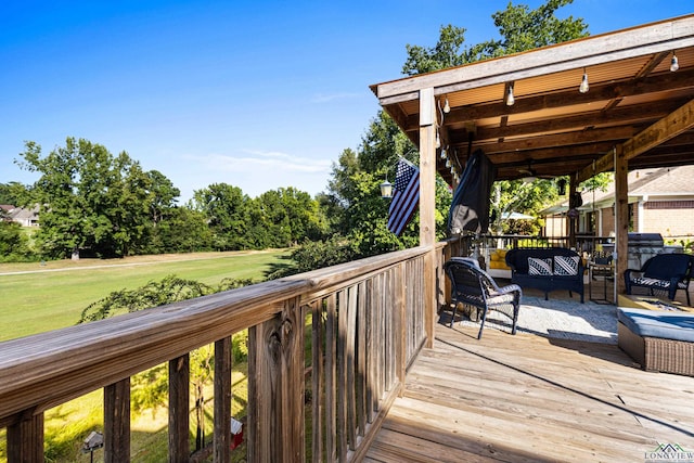 wooden terrace with an outdoor hangout area