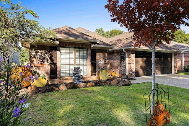 ranch-style house featuring a garage and a front yard