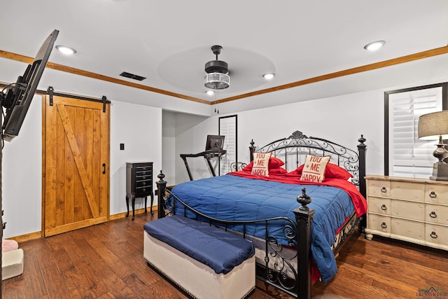 bedroom featuring a barn door, ceiling fan, dark hardwood / wood-style flooring, and crown molding