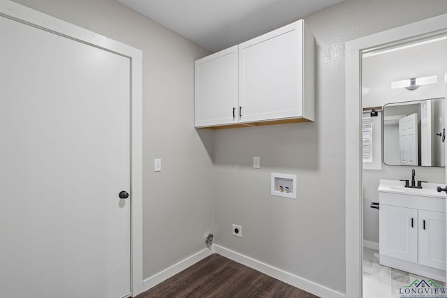 251 Crockett St, Lone Star, TX 75668 - laundry area with cabinet space, washer hookup, hookup for an electric dryer, and wood finished floors