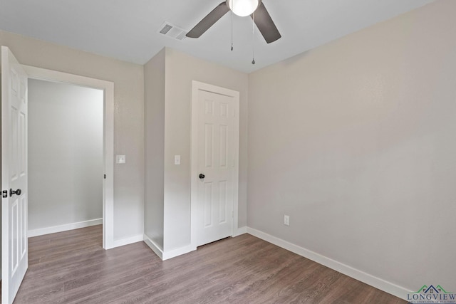 251 Crockett St, Lone Star, TX 75668 - unfurnished bedroom featuring wood finished floors and a ceiling fan