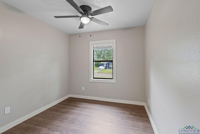 251 Crockett St, Lone Star, TX 75668 - empty room with dark wood-style flooring and ceiling fan