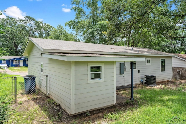 251 Crockett St, Lone Star, TX 75668 - rear view of property featuring roof with shingles