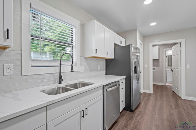 251 Crockett St, Lone Star, TX 75668 - kitchen with appliances with stainless steel finishes, white cabinetry, decorative backsplash, dark wood-style floors, and recessed lighting