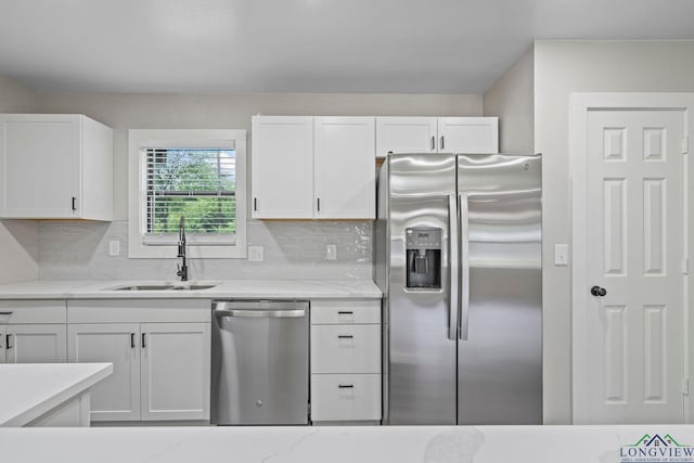 251 Crockett St, Lone Star, TX 75668 - kitchen featuring appliances with stainless steel finishes, white cabinetry, and decorative backsplash