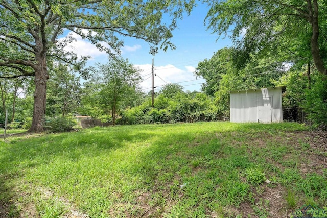 251 Crockett St, Lone Star, TX 75668 - view of yard with a shed