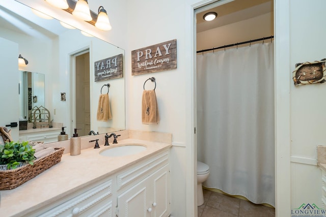 full bathroom with tile patterned flooring, toilet, and vanity