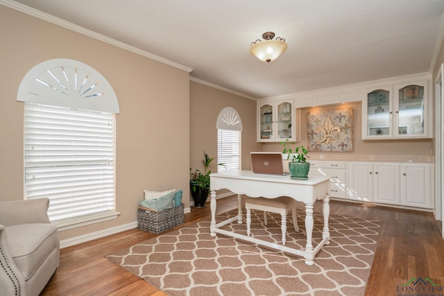 home office featuring crown molding, dark wood-style floors, and baseboards