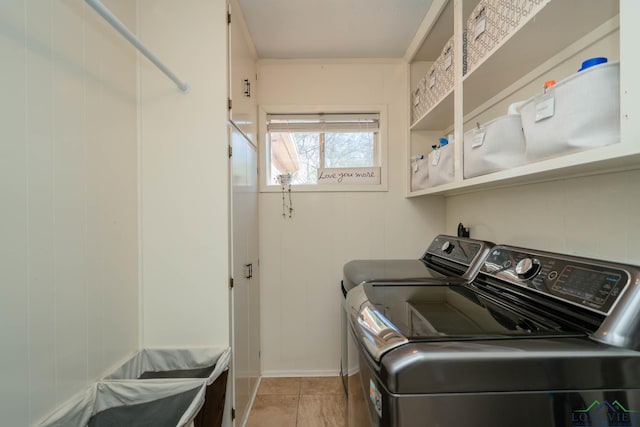 clothes washing area with laundry area and washer and clothes dryer