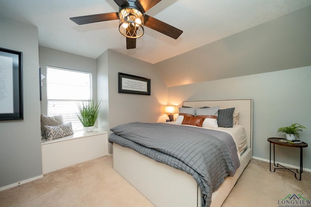 bedroom featuring baseboards, carpet, ceiling fan, and vaulted ceiling