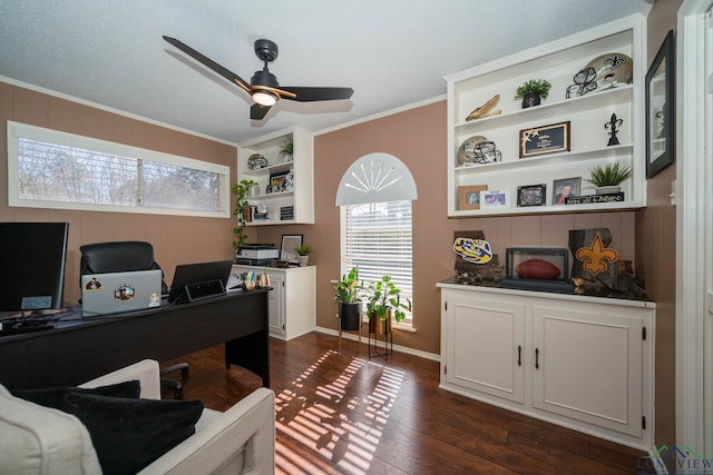 office area featuring crown molding, baseboards, dark wood-type flooring, and ceiling fan