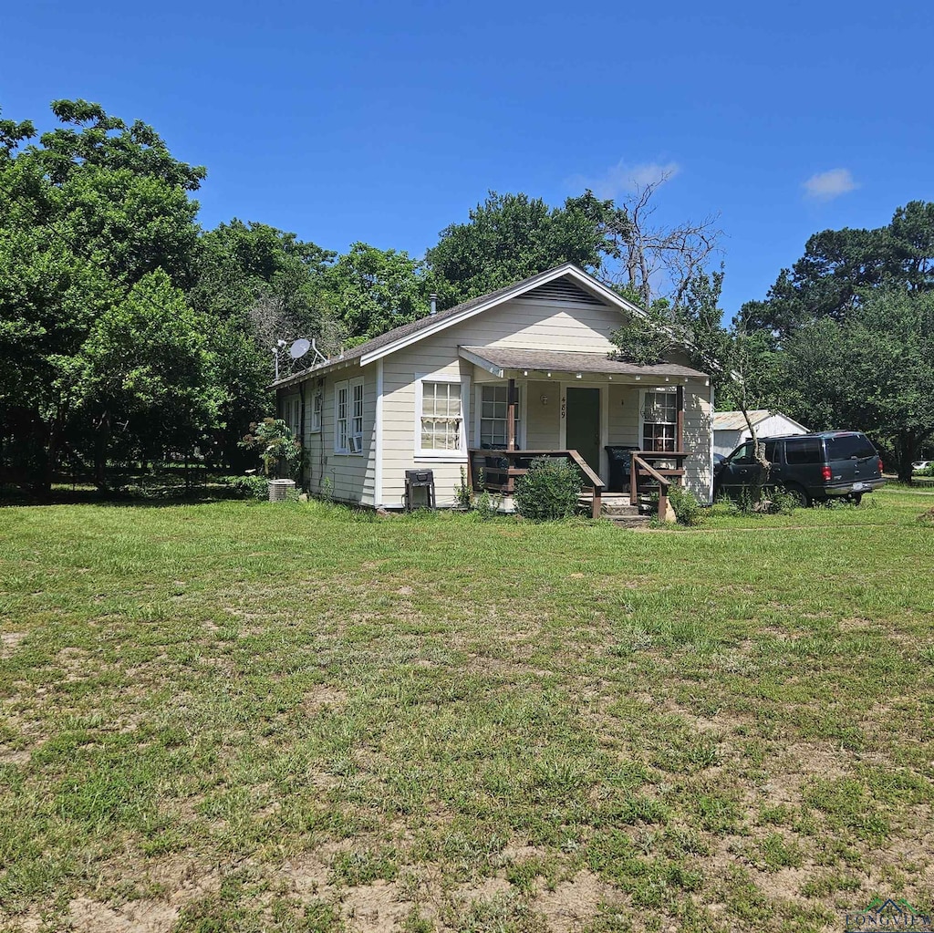 489 Raymer St, Hawkins, TX 75765 - view of front of property with a porch and a front yard