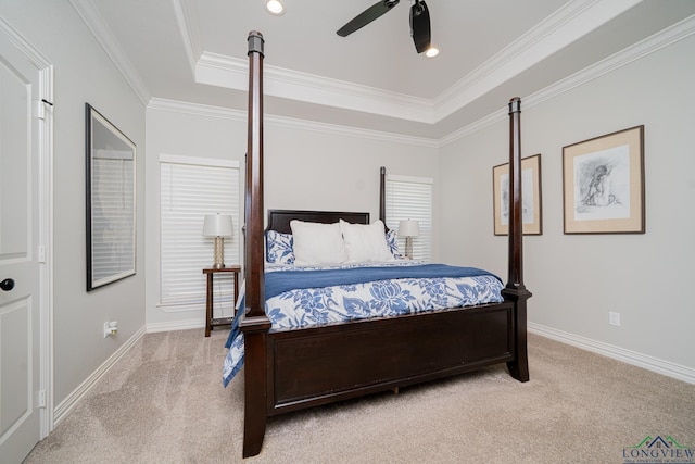 bedroom with light carpet, a raised ceiling, baseboards, and ornamental molding