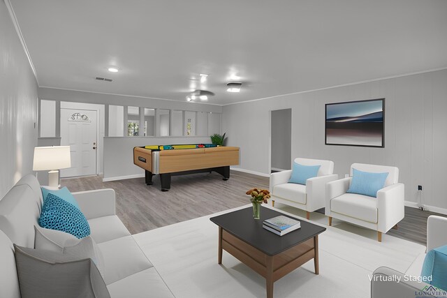 unfurnished living room with ceiling fan, a fireplace, hardwood / wood-style flooring, and ornamental molding