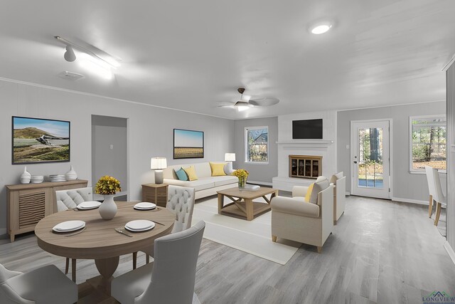 unfurnished living room with ceiling fan, hardwood / wood-style floors, and a healthy amount of sunlight