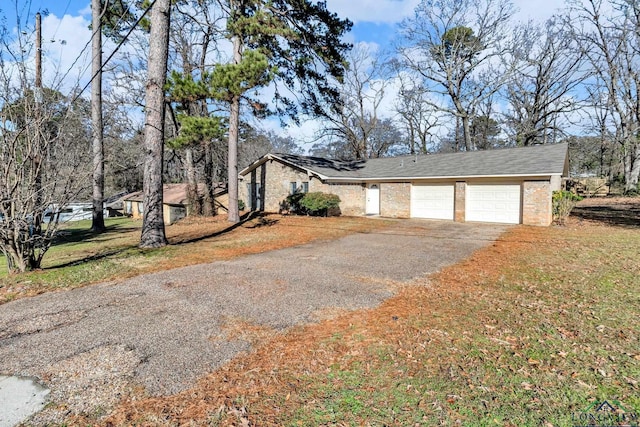 view of side of home featuring a garage