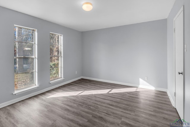 spare room featuring dark hardwood / wood-style floors