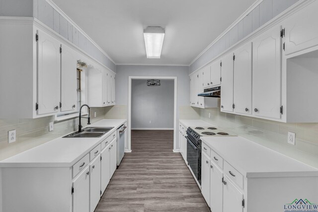 kitchen featuring range with electric stovetop, light wood-type flooring, white cabinetry, and a wealth of natural light