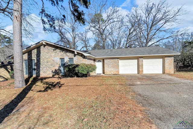 ranch-style house featuring a garage