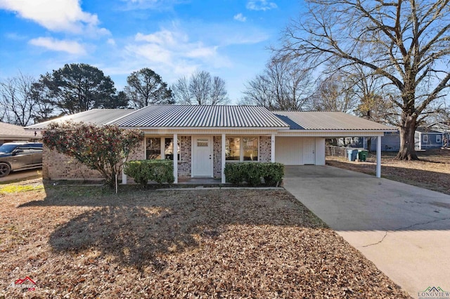 single story home featuring a carport