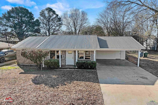 ranch-style home featuring a carport