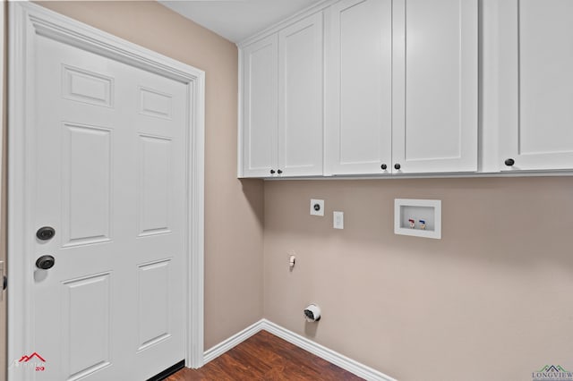 laundry room with cabinets, electric dryer hookup, washer hookup, and dark hardwood / wood-style flooring