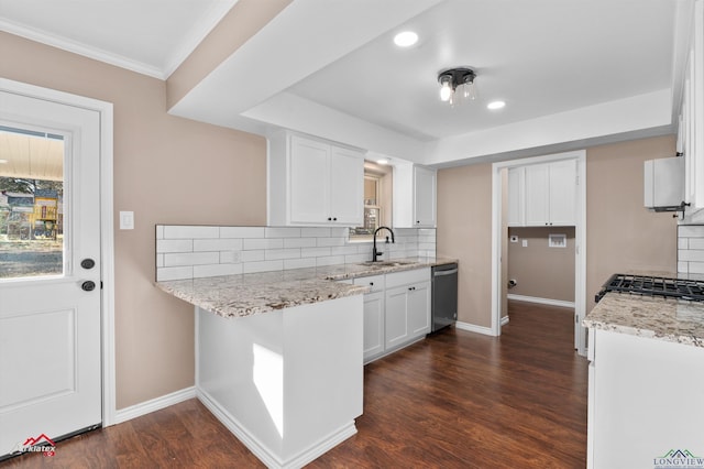 kitchen with dark hardwood / wood-style flooring, light stone countertops, decorative backsplash, and white cabinets