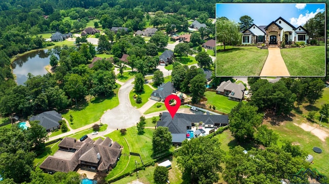 bird's eye view featuring a residential view and a water view