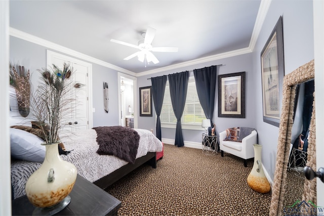 bedroom featuring carpet floors, a ceiling fan, baseboards, ensuite bath, and crown molding